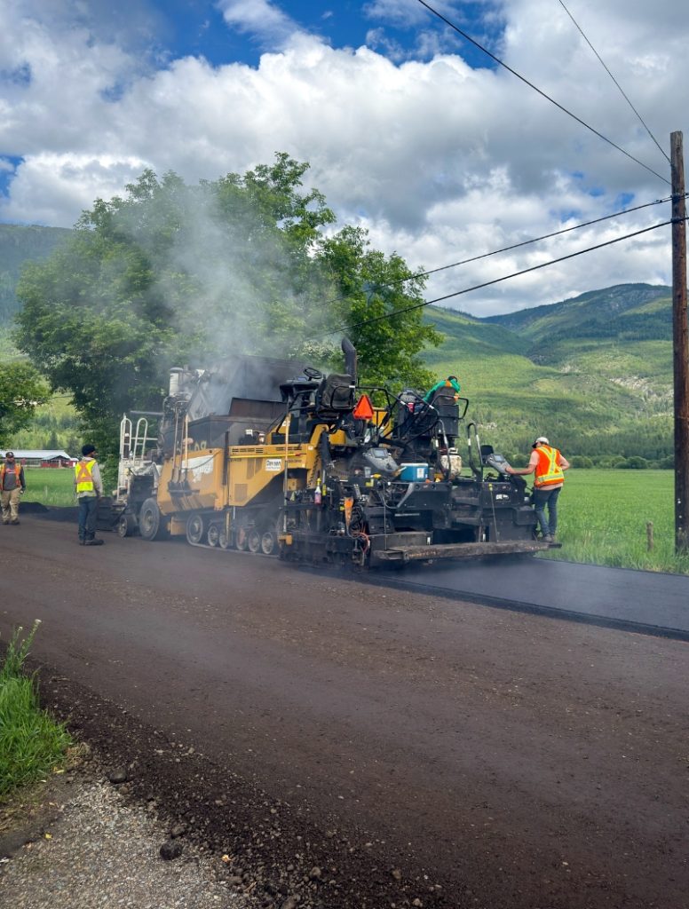Dawson Construction paving crew placing asphalt during the City of Salmon Arm 2026 road improvement program in Salmon Arm, British Columbia.